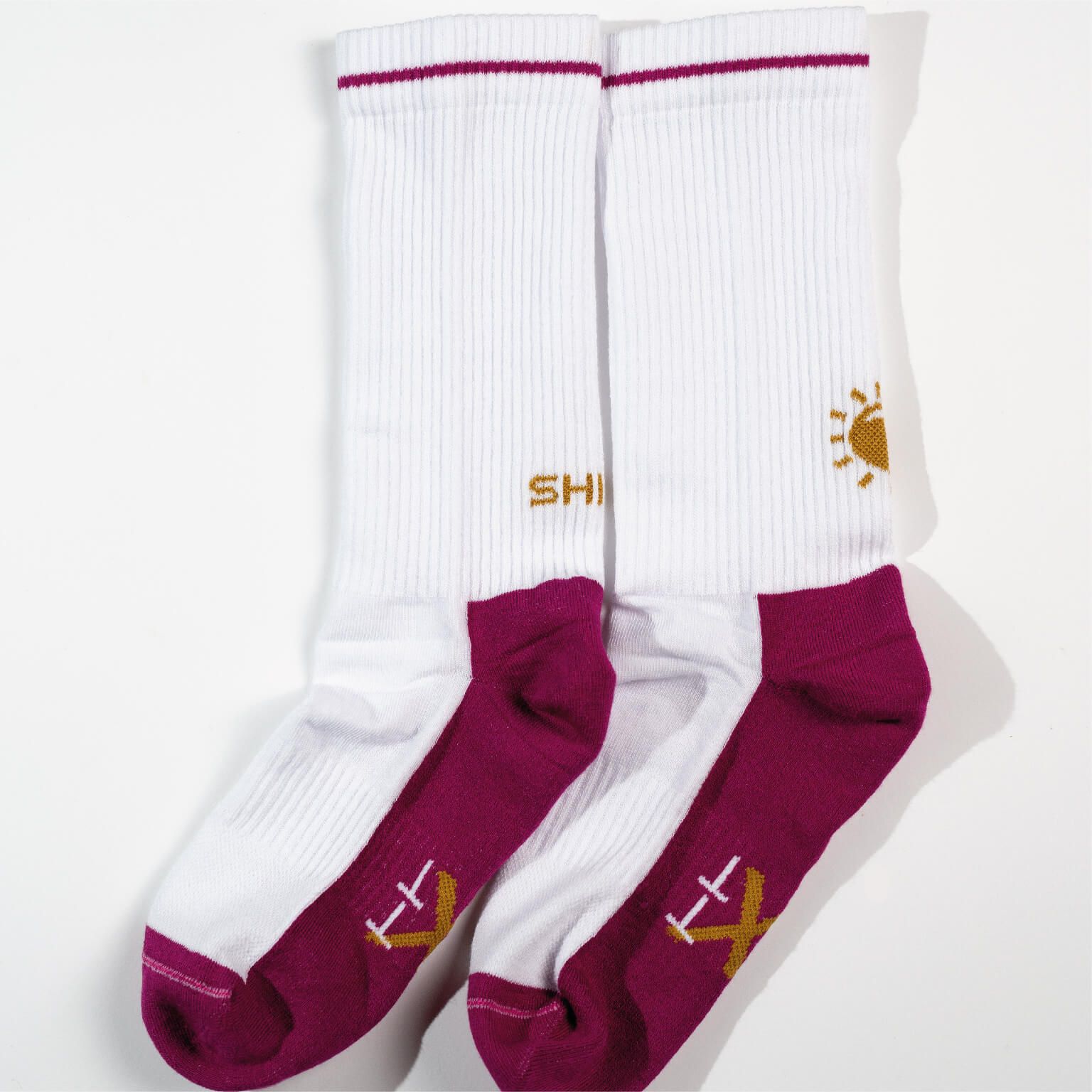 shine socks laying sideways on the ground