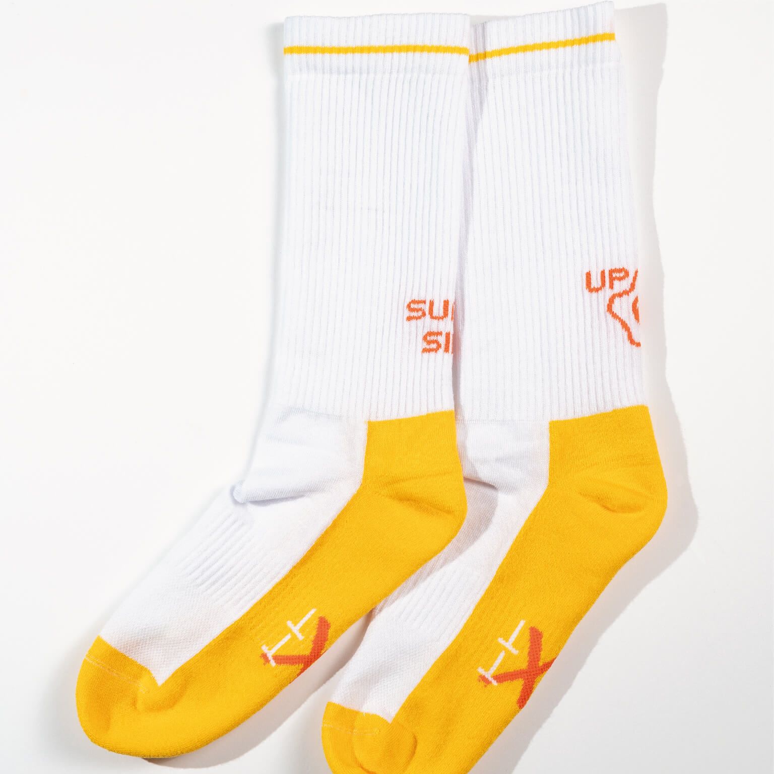 sunny socks laying sideways on the ground